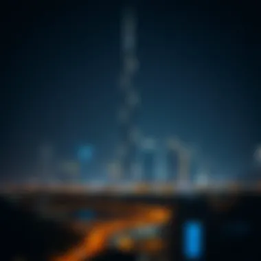 Night view of Lereve Tower illuminated against the Dubai skyline