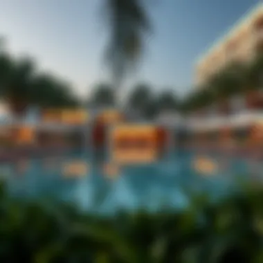Luxurious swimming pool surrounded by palm trees at Oceana Residence